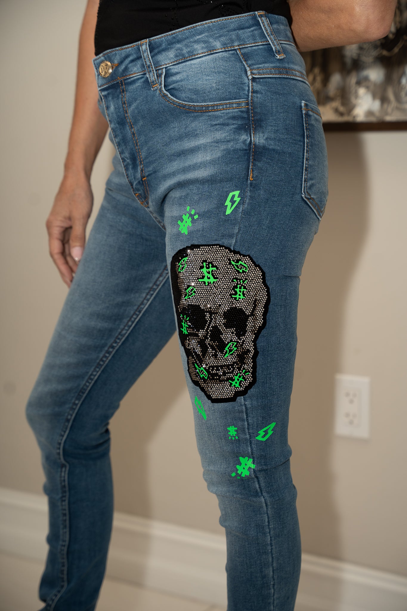 Blue denim jeans with crystal skeleton