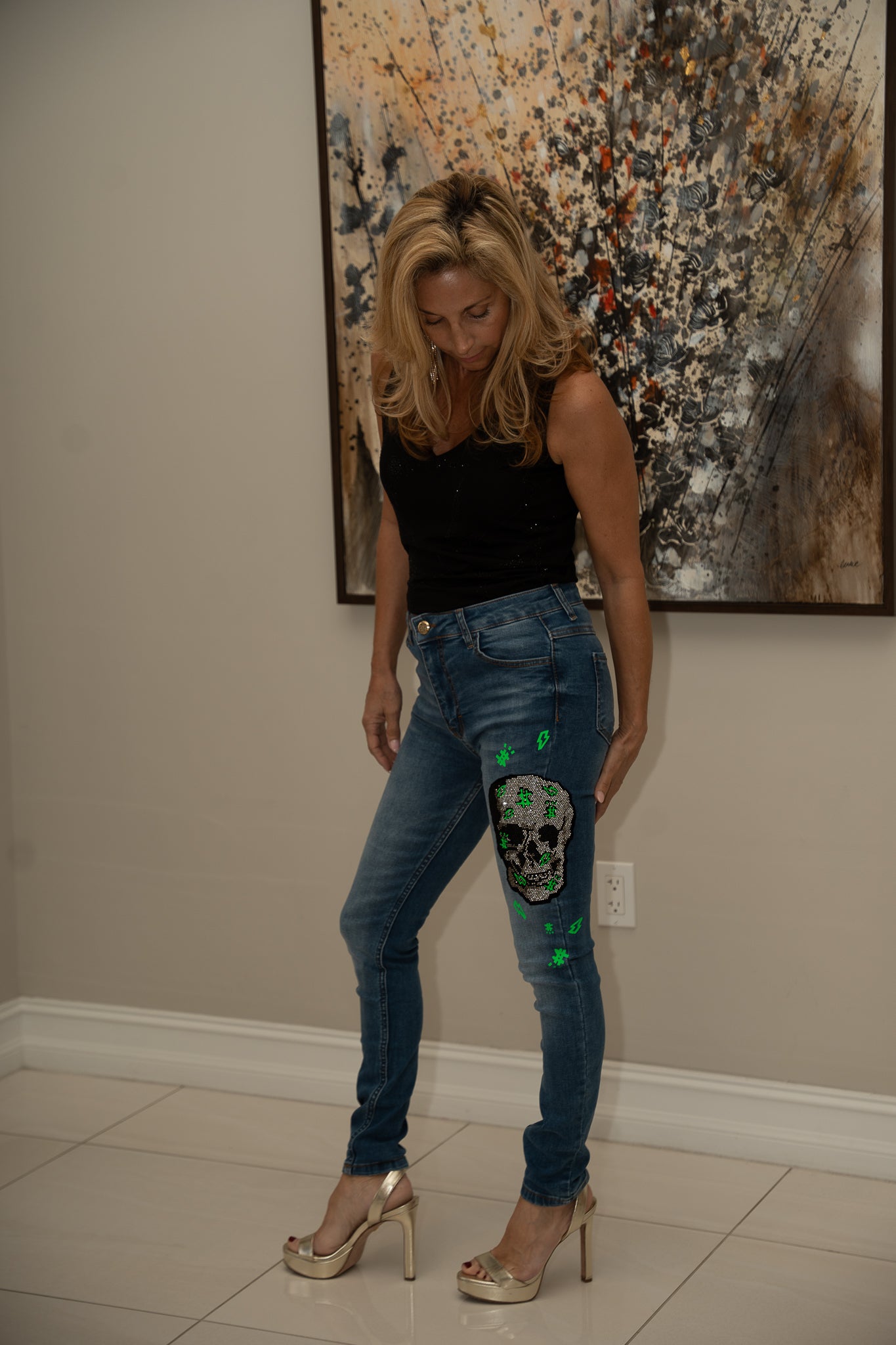 Blue denim jeans with crystal skeleton